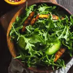 Autumn Arugula Salad with Caramelized Squash, Spiced Pecans, and Pomegranate Ginger Vinaigrette