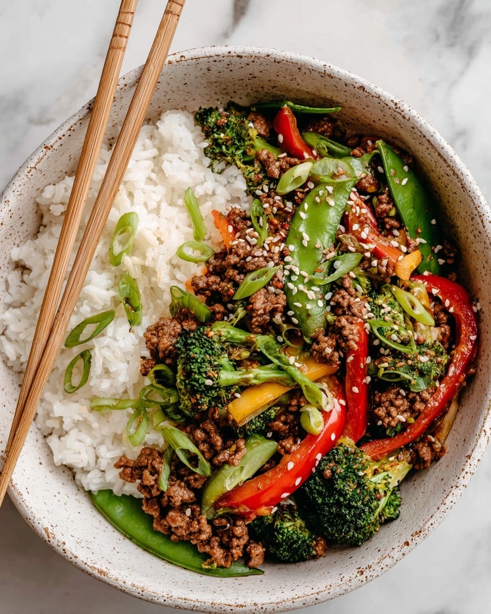 A white bowl on a white marbled surface filled with four distinct sections: a portion of fluffy white rice on the top left; next to it on the top right, cooked mushrooms with a light brown color and slightly charred edges; on the bottom left, vibrant green broccoli with a roasted texture; and on the bottom right, a colorful mix of sautéed vegetables including green zucchini slices, bright red bell pepper strips, and green snap peas. Centered near the bottom, there is a pile of finely crumbled cooked ground meat with a rich brown color. The layers are clearly separated with varying textures, showing the softness of rice, the crispness of broccoli, and the tenderness of meat and vegetables. photo taken with an iphone --ar 4:5 --v 7